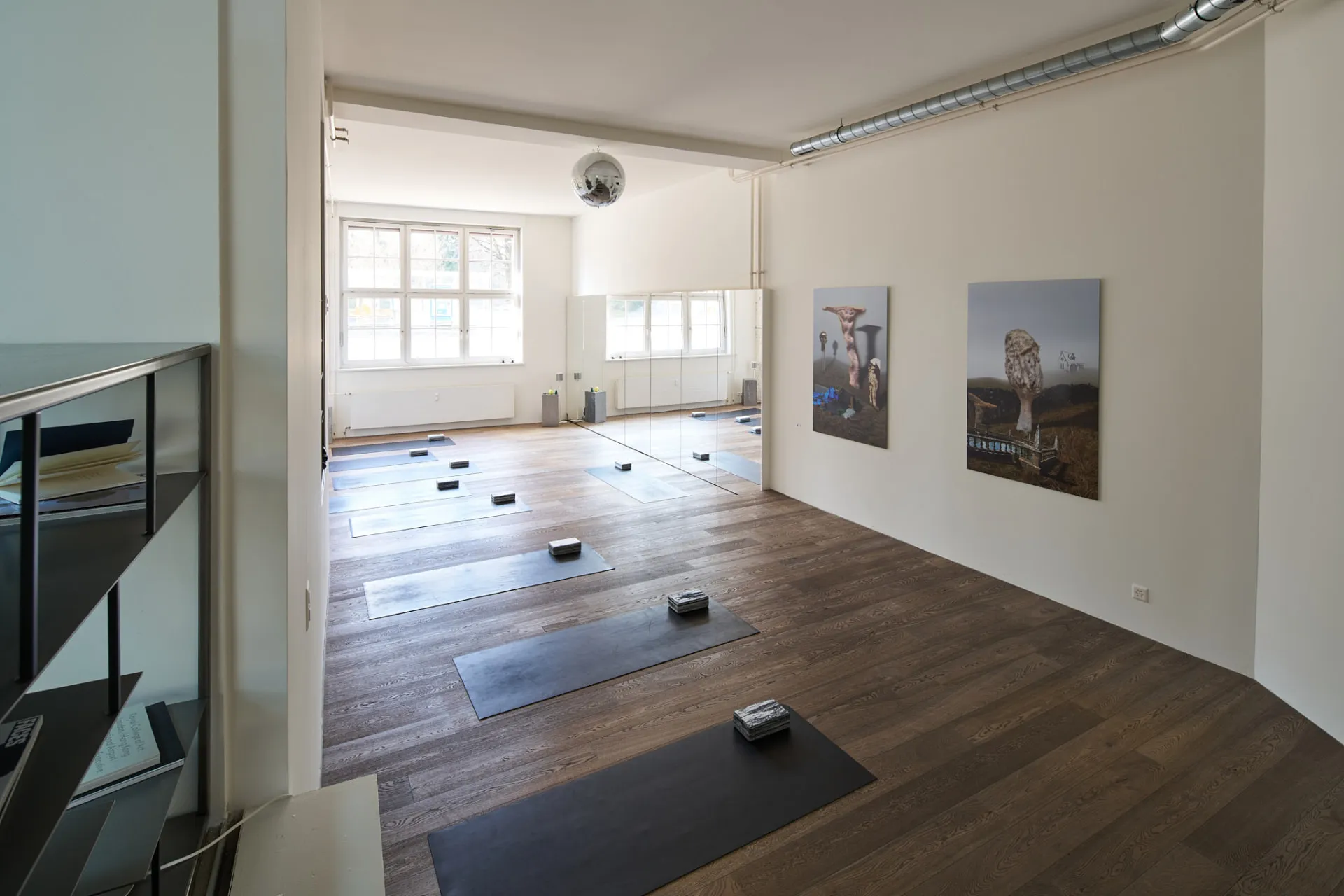 Claw Studio space in Zurich with yoga mats, mirrors and artwork